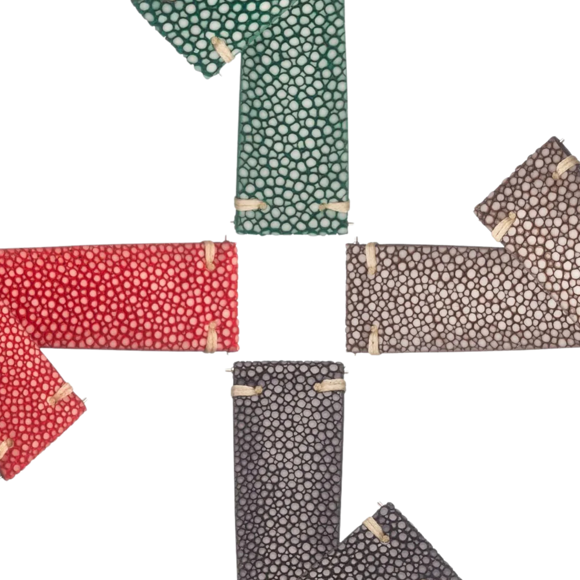 Crafting luxury Sting Ray watch bands by hand on a wooden workbench.